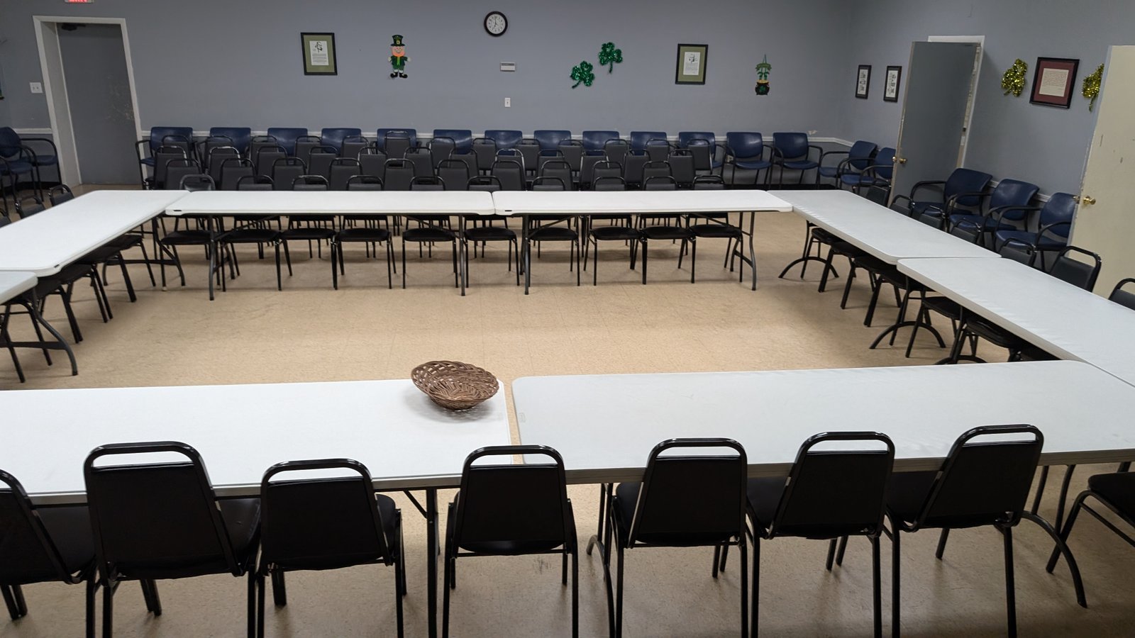 Chairs and tables arranged in the 13th Street Clubhouse meeting room