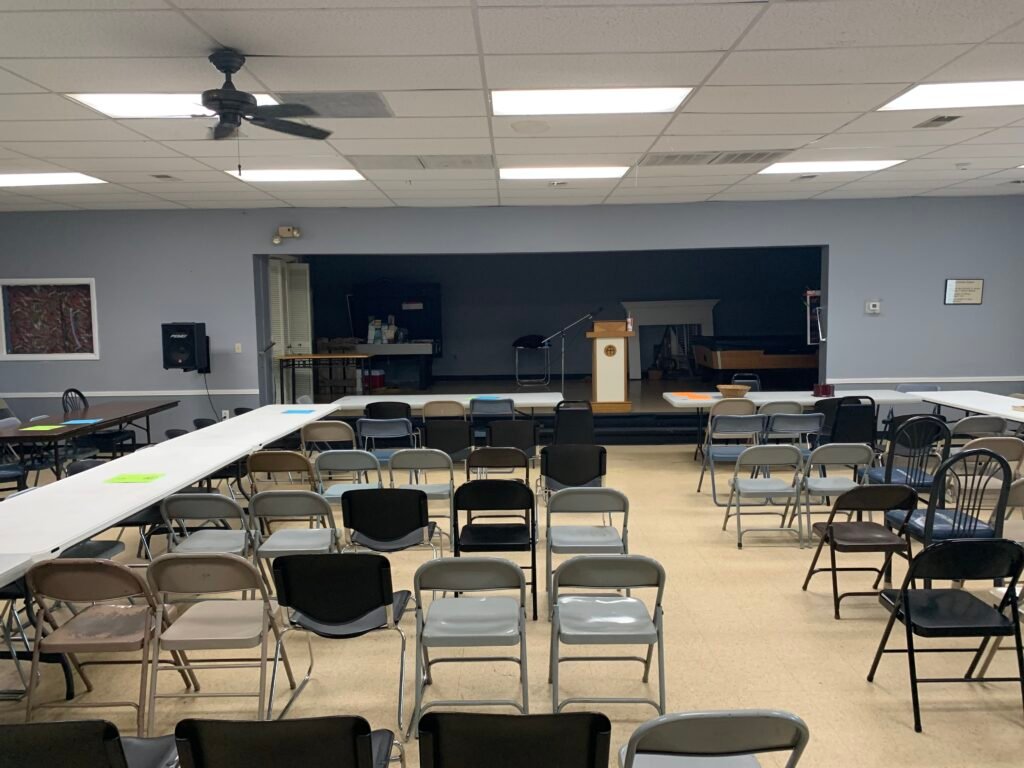Main meeting room and stage inside the 13th Street Clubhouse